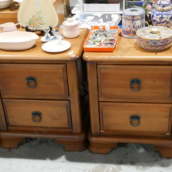 pair of solid 2 drawer bedside cabinets with cast metal drop handles