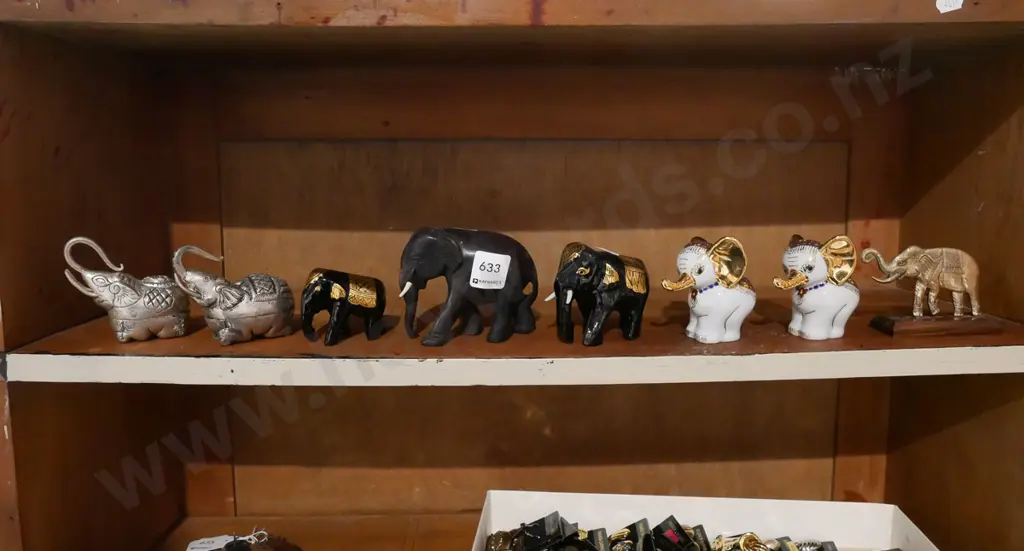 shelf of elephant figurines Image 1++