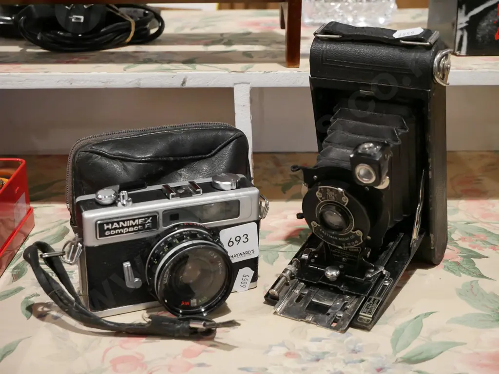 vintage Kodak folding camera and a Hanimex 35mm film camera Image 1++