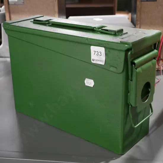 green painted ammunition tin