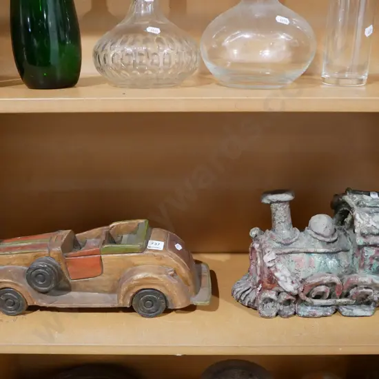 studio pottery model railway locomotive and a carved wooden toy car