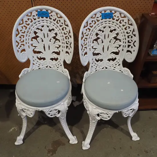 2x cast alloy patio chairs with vinyl squabs