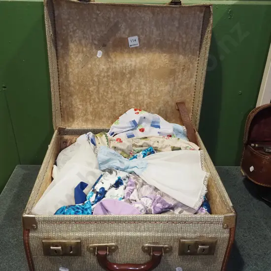 small suitcase of dolls clothes