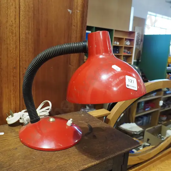 red adjustable bedside lamp
