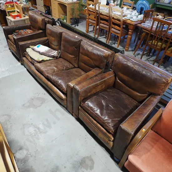 3 piece brown leather lounge suite - 2 seater and 2x singles - has domed edging, wear and tear to leather