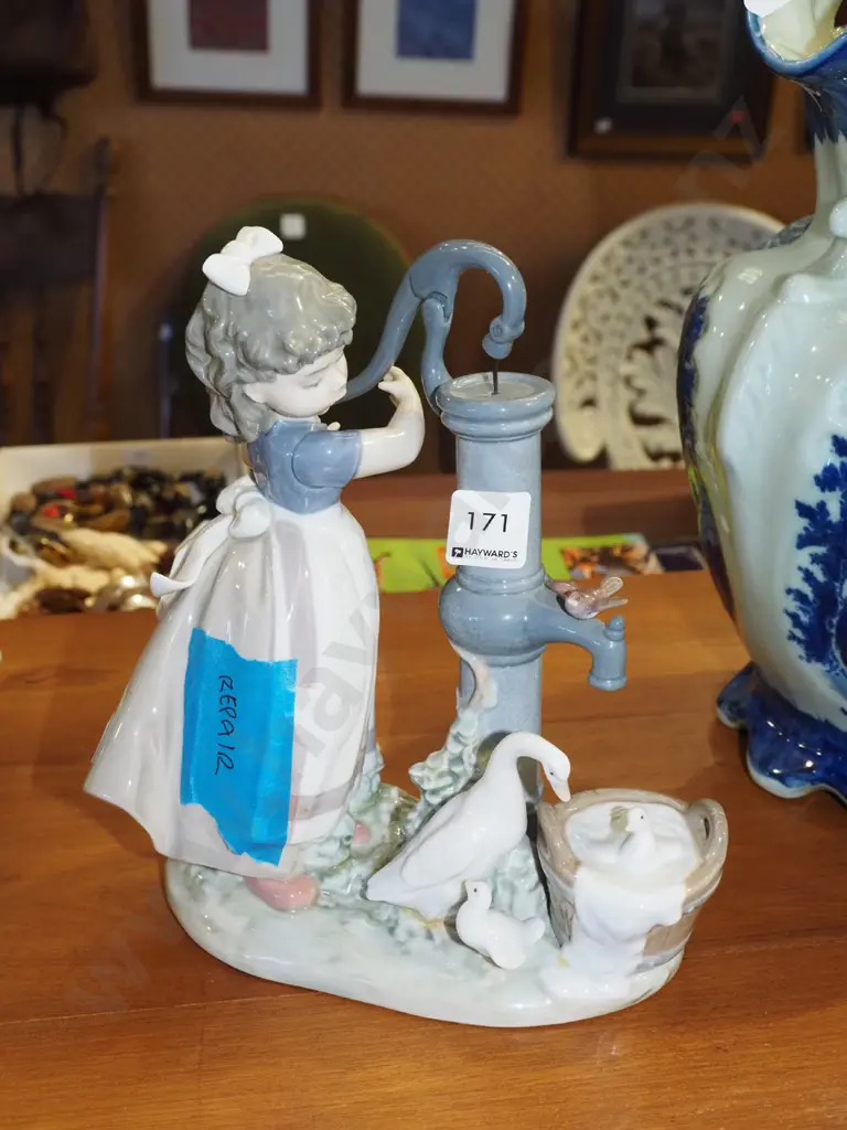 Lladro figurine - girl at pump - has repair H250 Image 1++