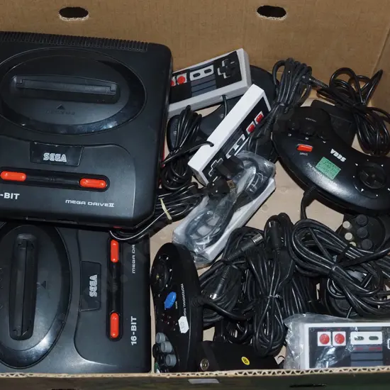 box: Sega Mega Drive II game consoles and various controllers