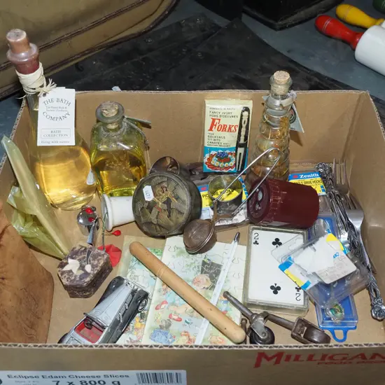 box; bath soaps, whistle, small puzzles etc
