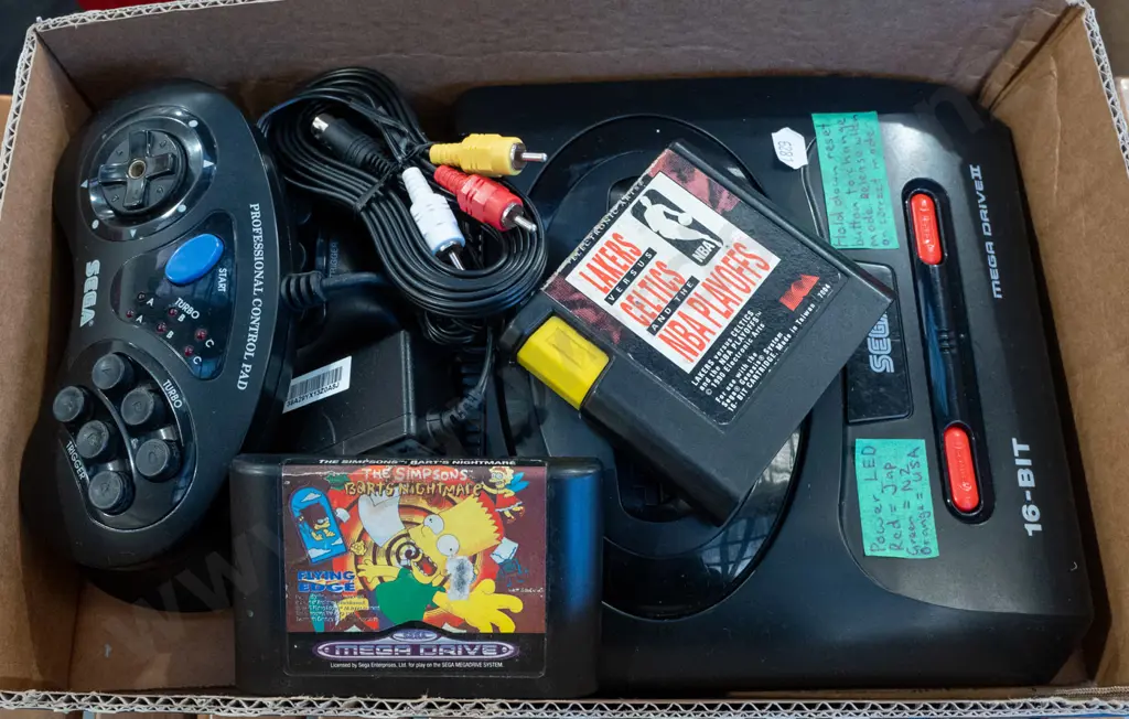 box: Sega Mega Drive II console, game cartridges, controllers Image 1++