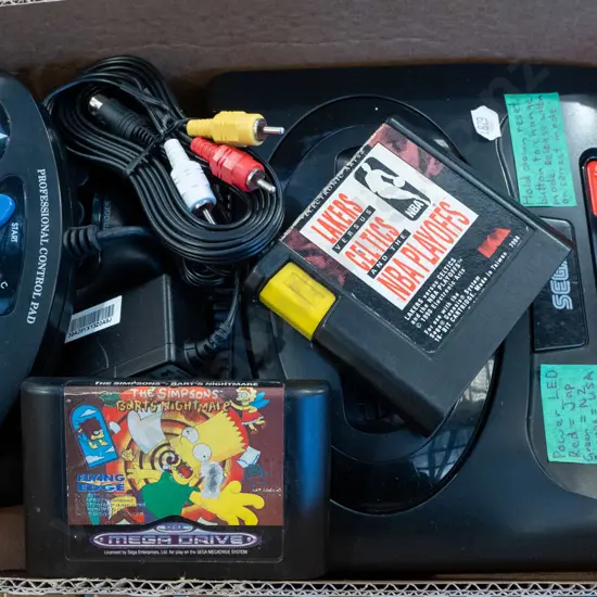 box: Sega Mega Drive II console, game cartridges, controllers