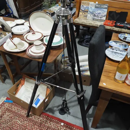 black and chrome floor lamp in the shape of a vintage tripod - no shade