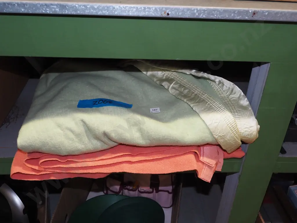 pink woollen and green woollen blankets Image 1++