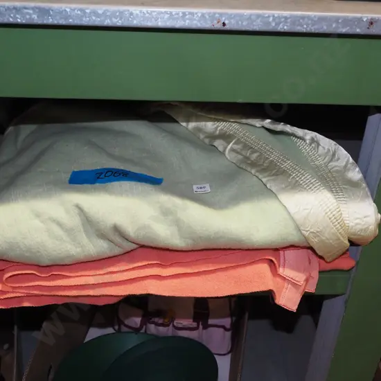 pink woollen and green woollen blankets