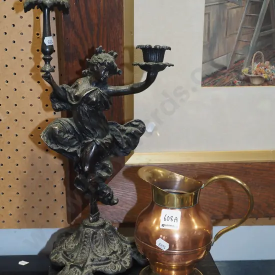 cast alloy figural candle holder and acopper and brass jug