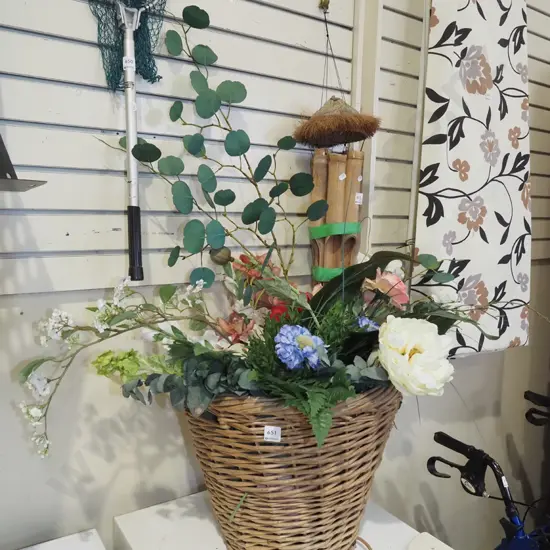 faux flowers in cane basket