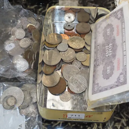 tin of various notes and coins