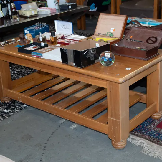 heavily scratched coffee table with magazine shelf