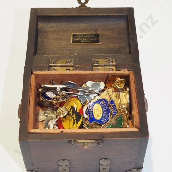 small wooden chest of badges & pins