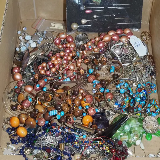 box of hat pins and costume jewellery