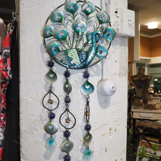 metal and glass peacock themed garden art