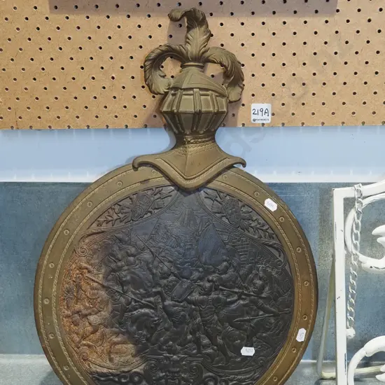 cast metal wall metal ornament with knight and battle motifs - corosion