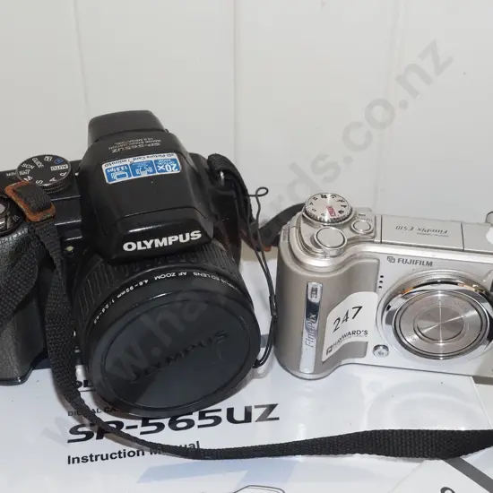 Fuji digital camera, Olympus digital camera - both with instructions