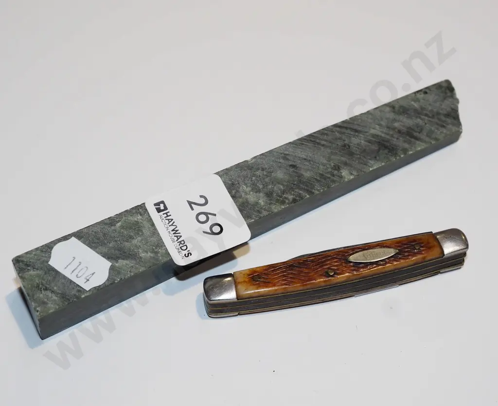 small pocket knife, cut green stone Image 1++