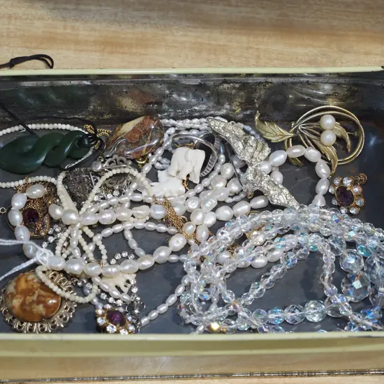 tin of costume jewellery