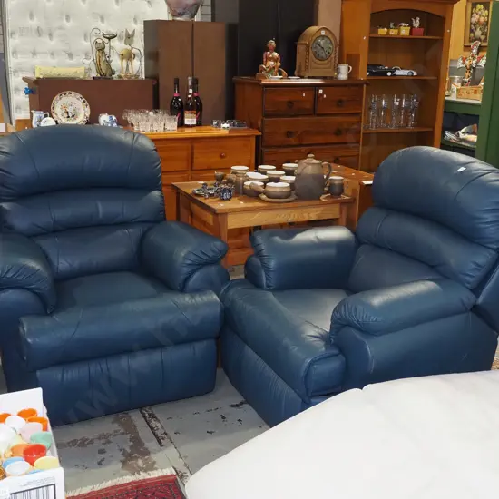 2x blue leather upholstered reclining armchairs