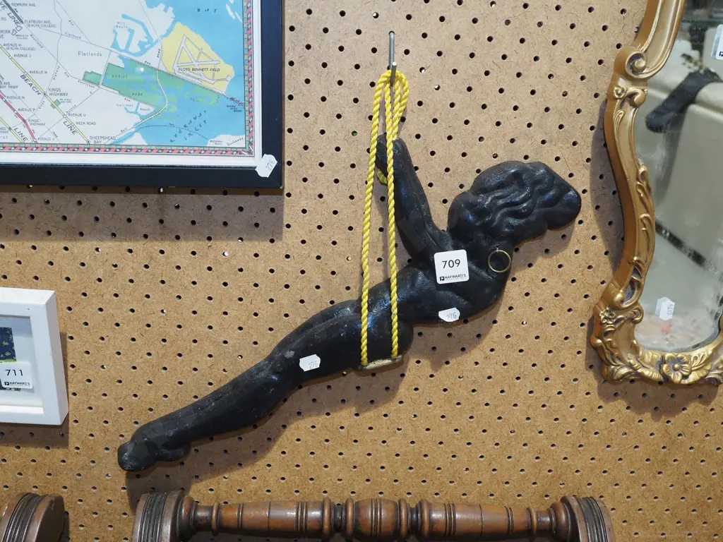 cast alloy wall silhouette - woman on swing Image 1++