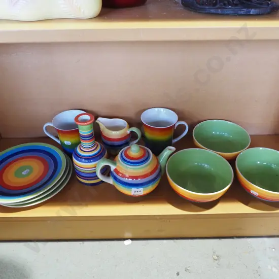 assorted hand painted rainbow decorated bowls, plates, cups etc