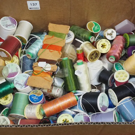 box of sewing threads
