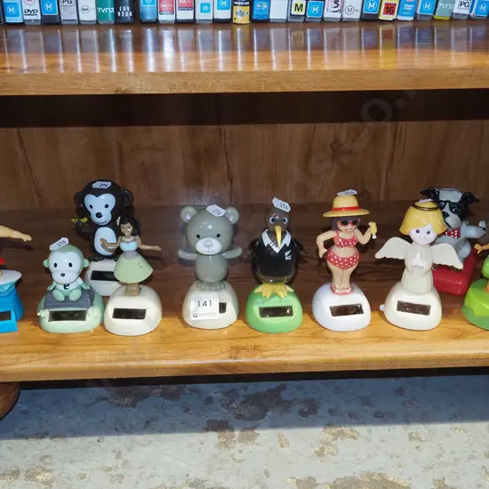 assorted solar powered plastic dancing figurines