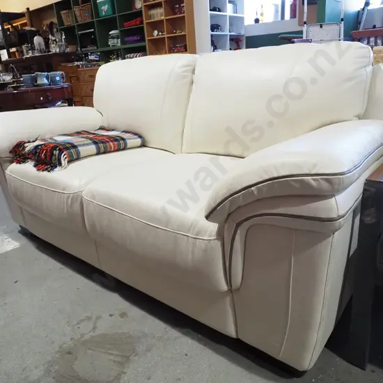 cream leather 2 seater settee - needs a slight clean