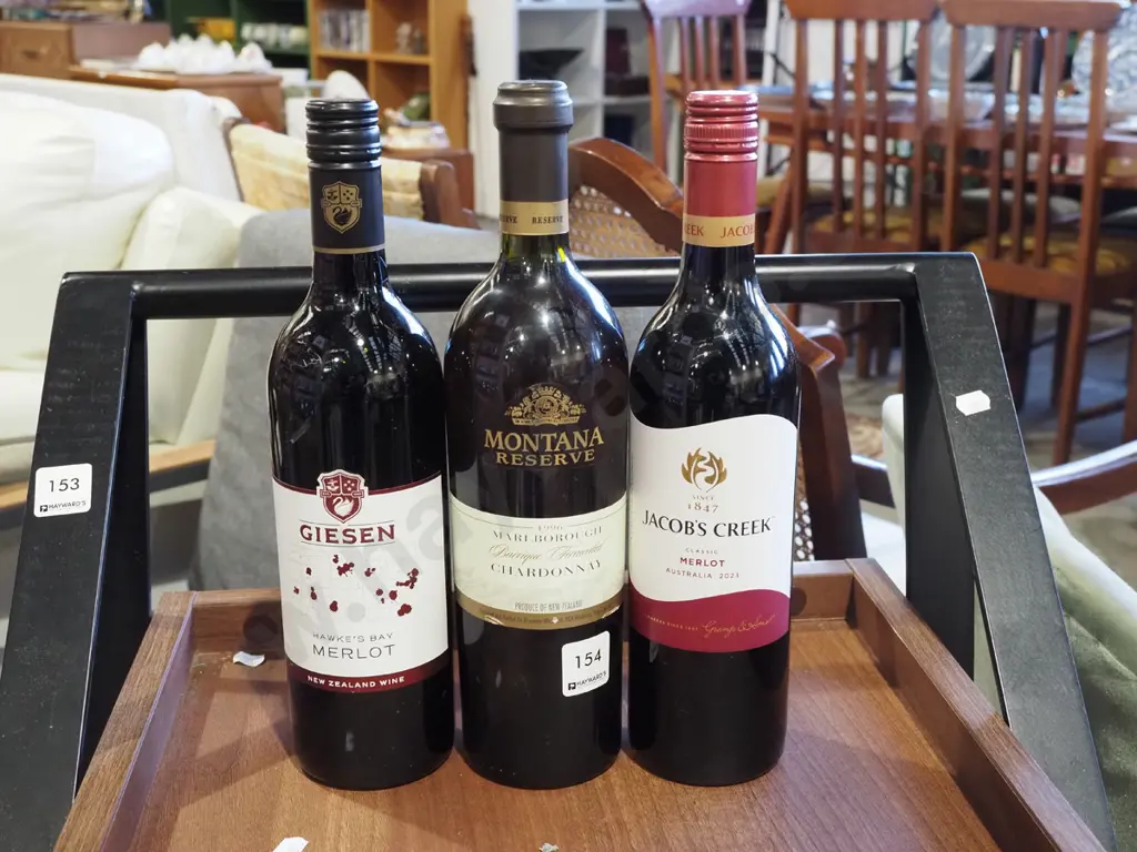 bottle of Hawkes Bay merlot 2022, Marlborough chardonnay, Jacobs Creek merlot 2023 Image 1++