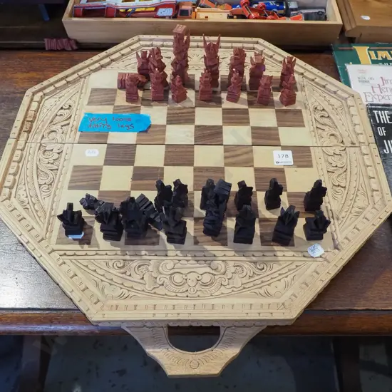 carved wooden chess set with very loose fitting legs