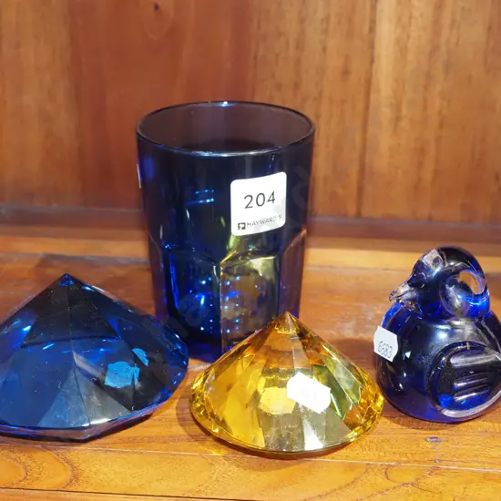 blue glass tumbler, paperweights, bird figurine