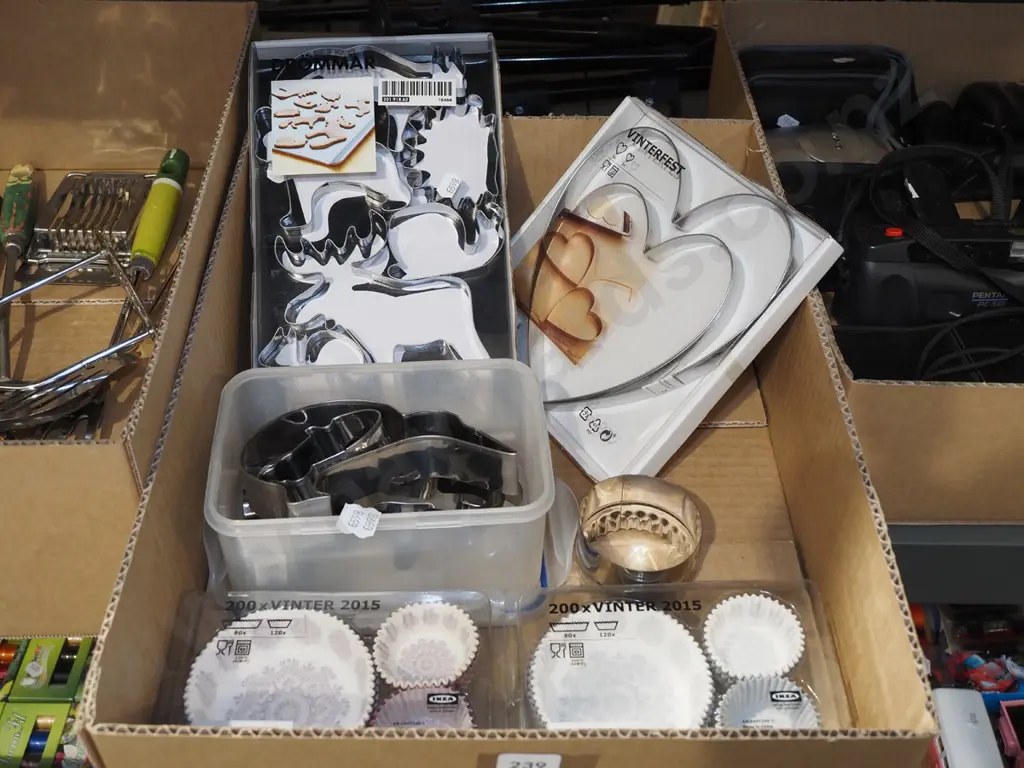 box; assorted cookie cutters, patty cups Image 1++