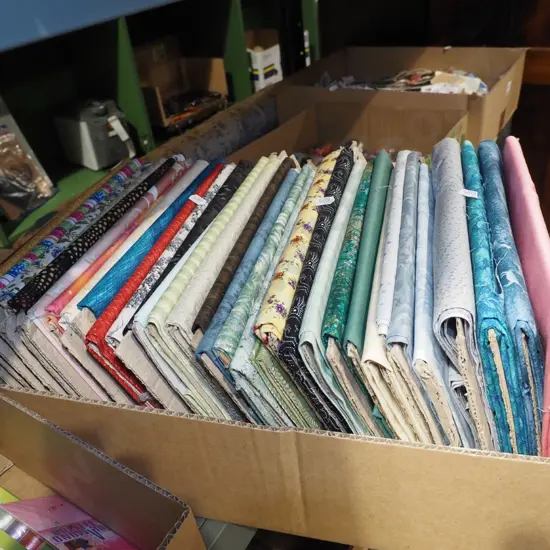 box of fabric pieces