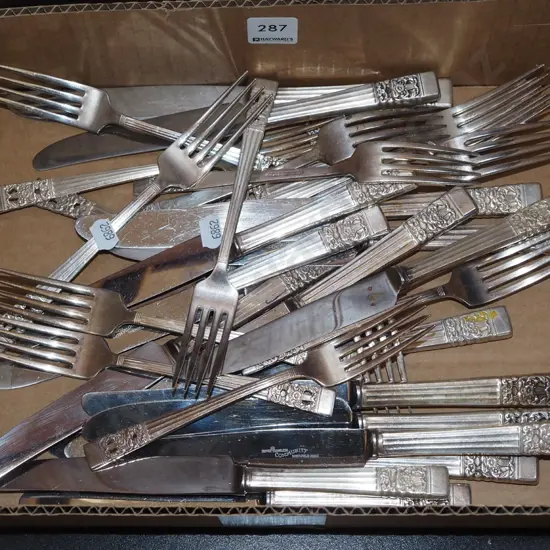 box of plated knives and forks