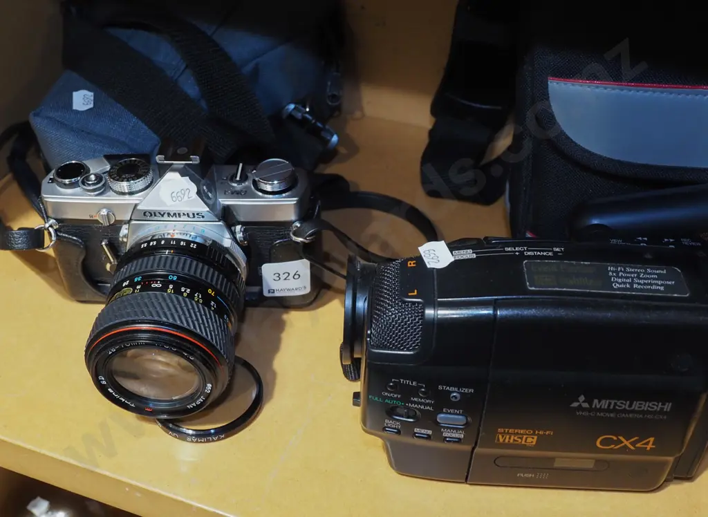 Olympus OM-1 35mm SLR film camera, Mitsubishi CX4 VHS-C camcorder Image 1++