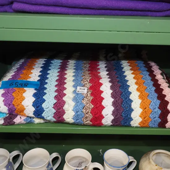 multi coloured crochet blanket