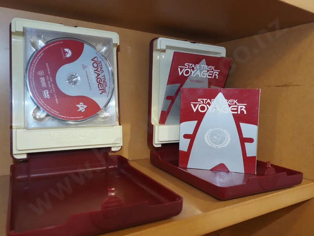 2x plastic cased sets of Star Trek Voyager DVDs Image 1++
