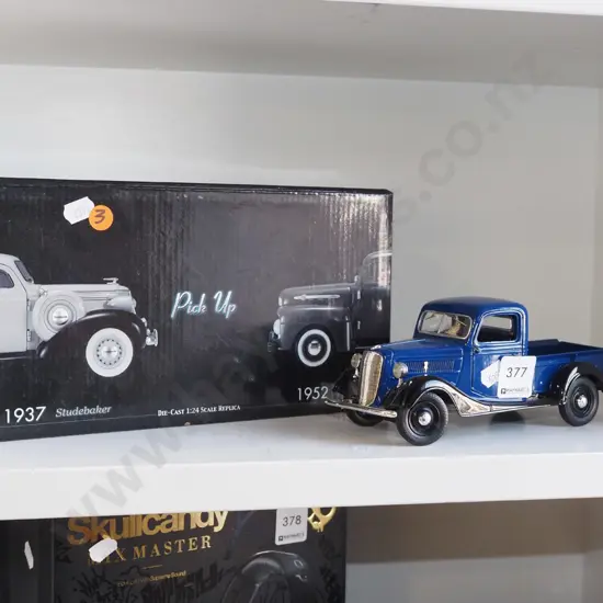 boxed model of a 1937 Studebaker pick up truck