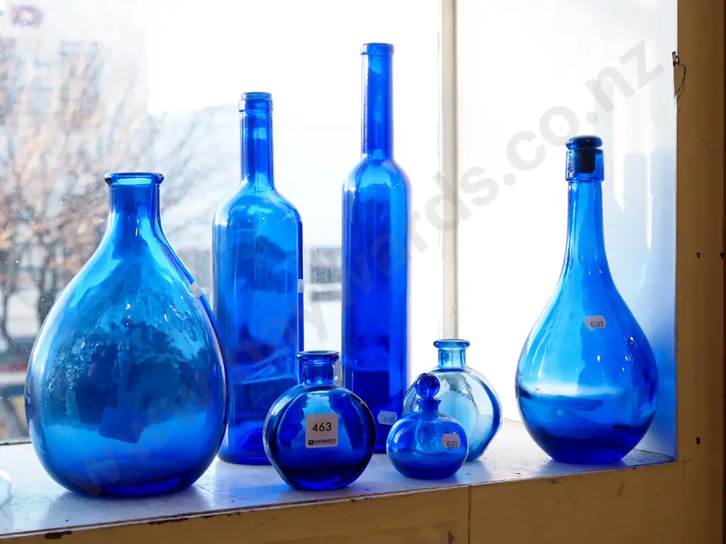 assorted blue glass bottles Tallest H340 Image 1++