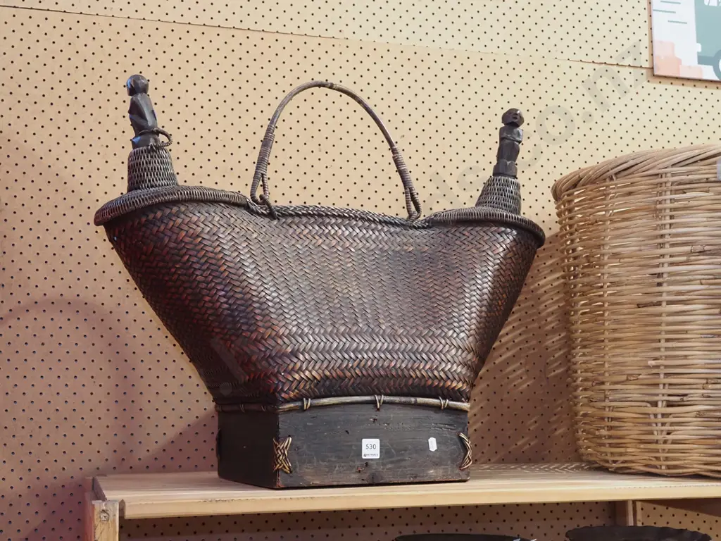 dark brown wicker basket with 2 tapered handles and carved wooden figural stoppers H600 Image 1++