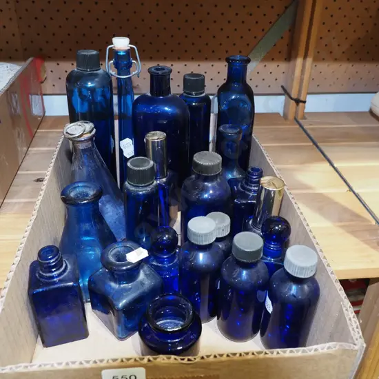 box of blue glass bottles