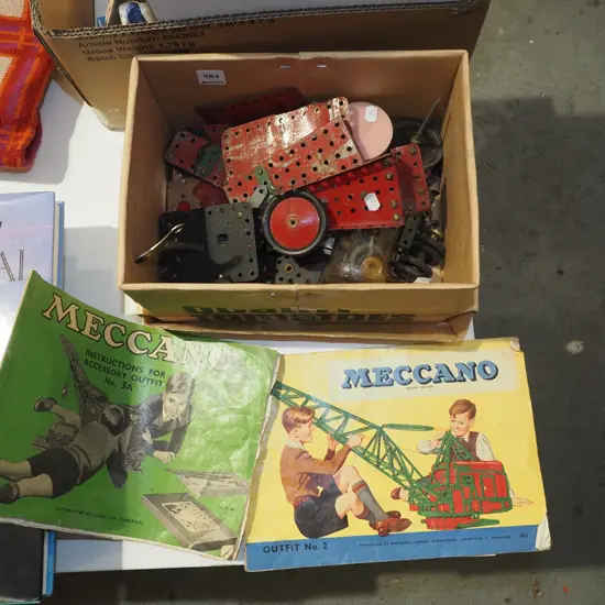 vintage Meccano pieces, instruction book
