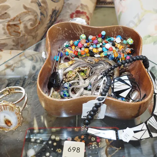 wooden box of costume jewellery