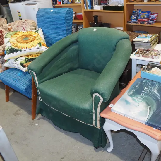 green upholstered tub chair